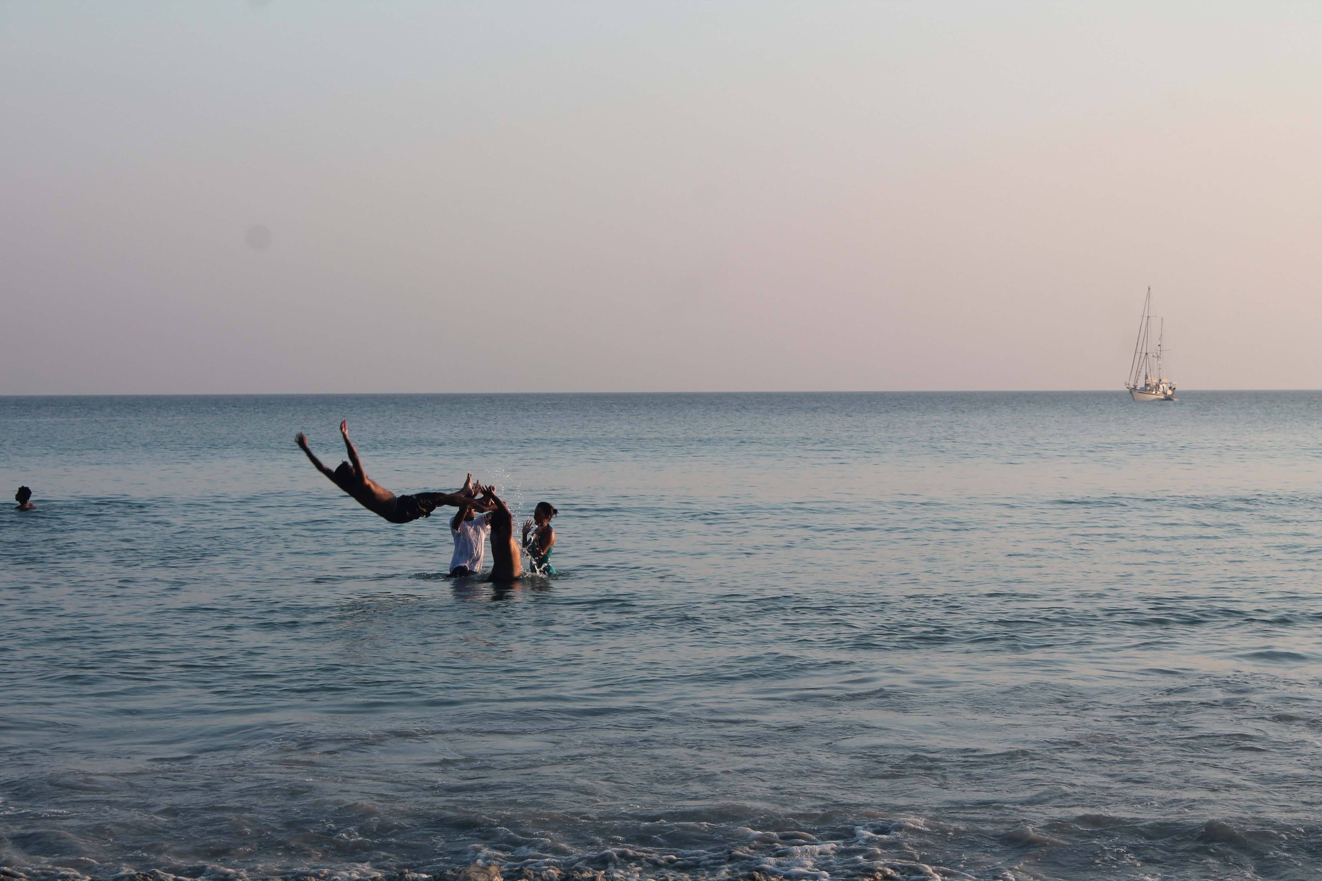 Jumping into the water at Radhanagar beach