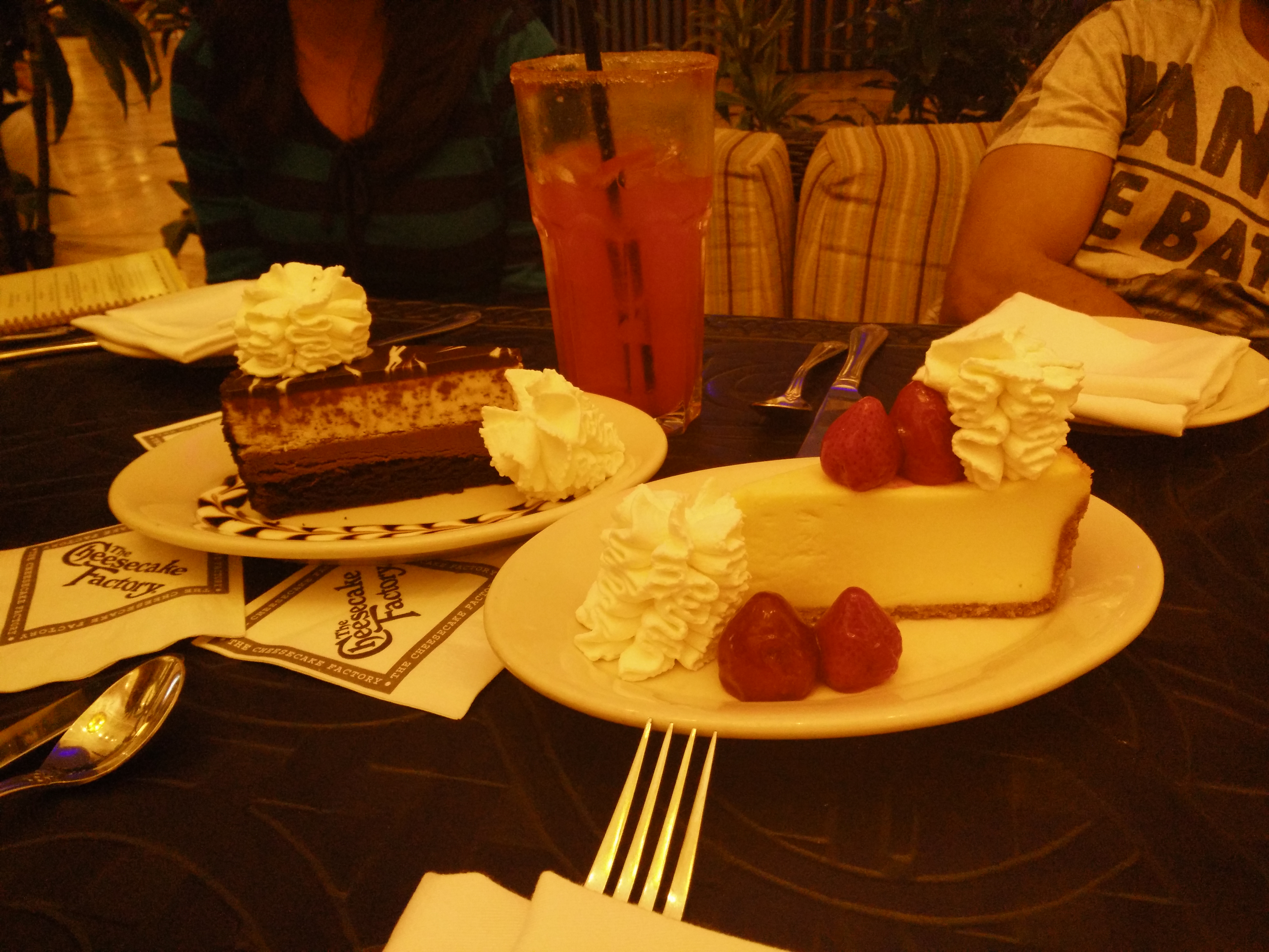 eating strawberry cheesecake at cheesecake factory