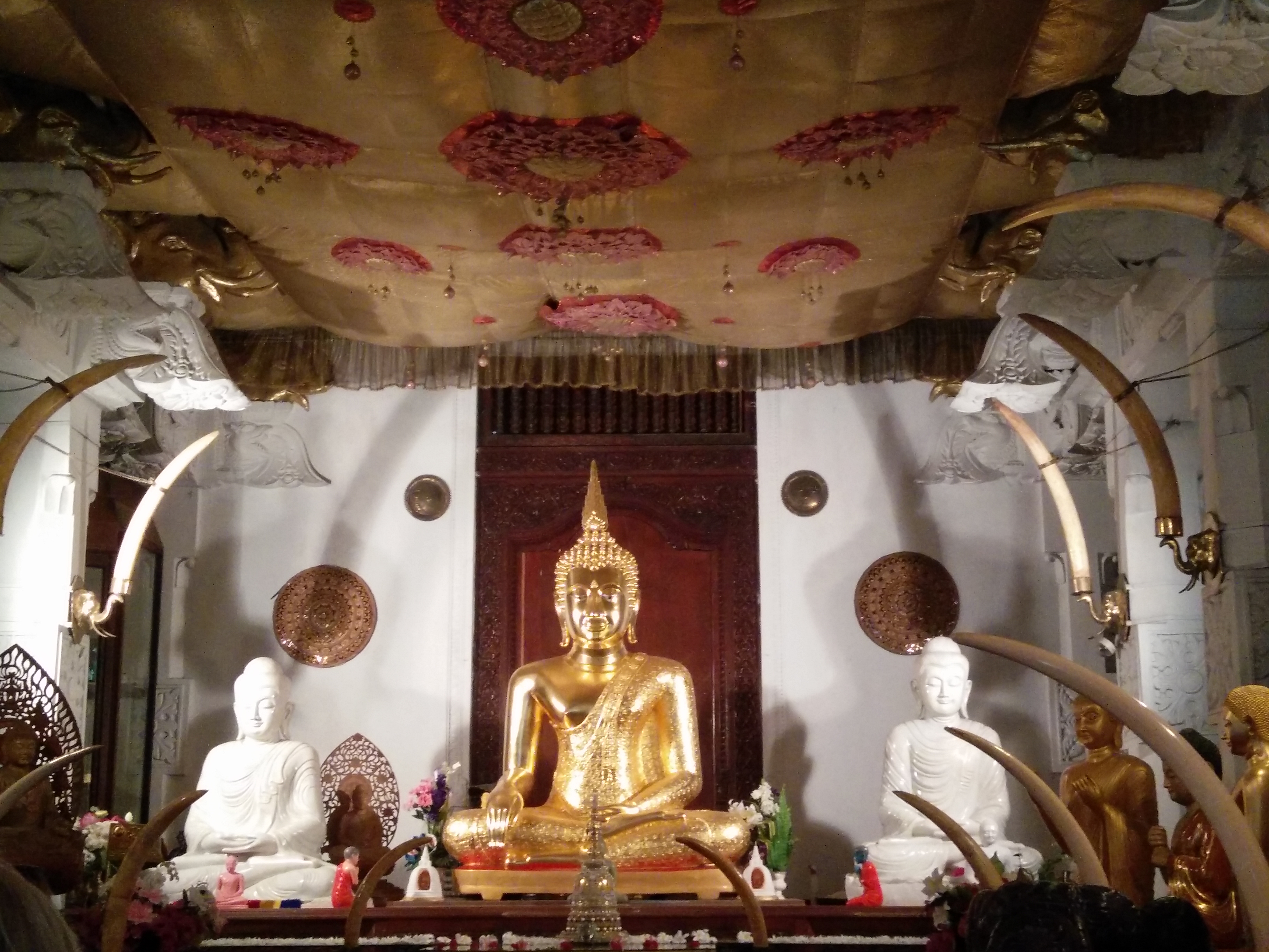 buddha inside the temple of tooth relic in kandy sri lanka