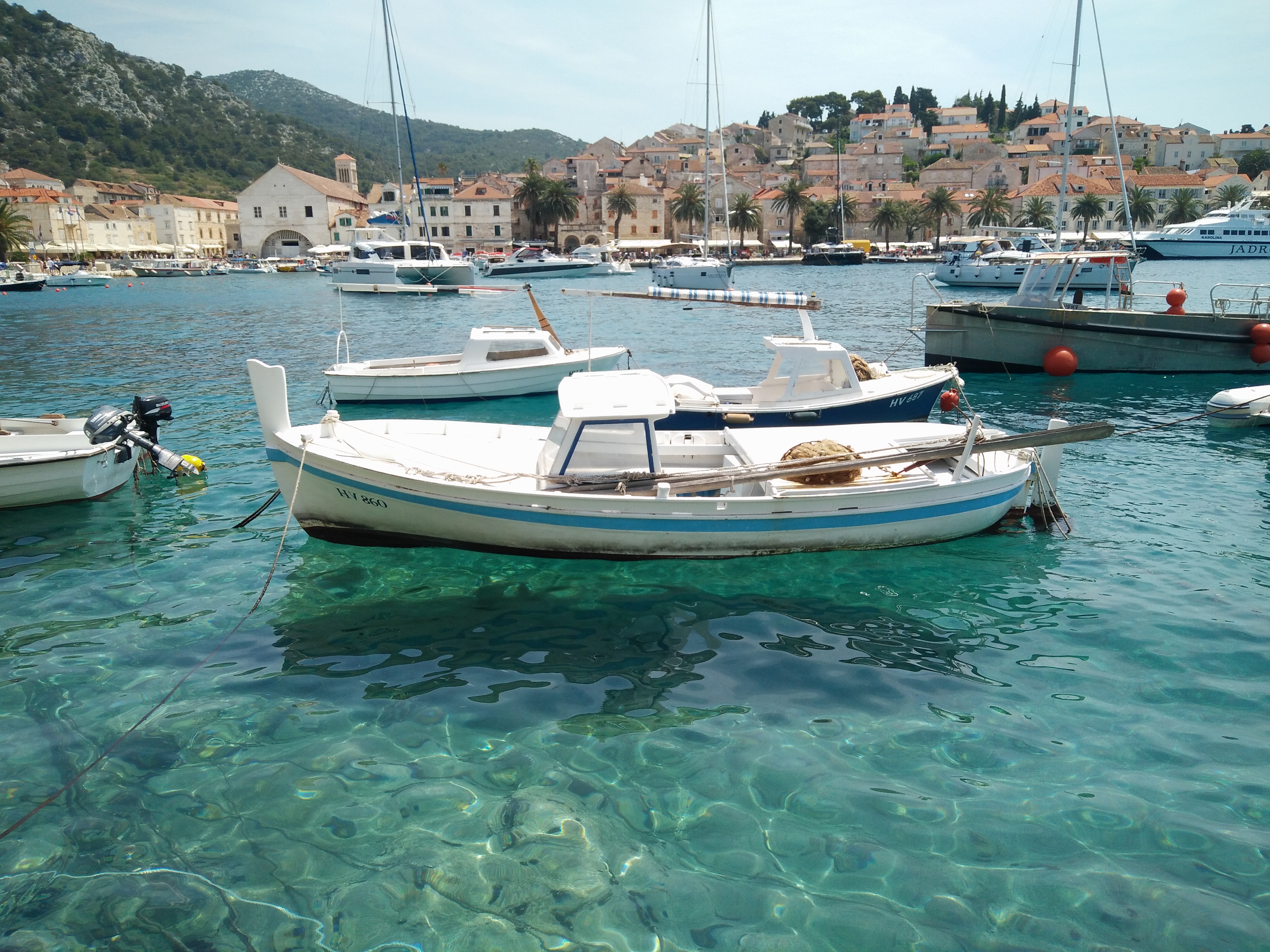 Boats on clear water in Hvar Croatia