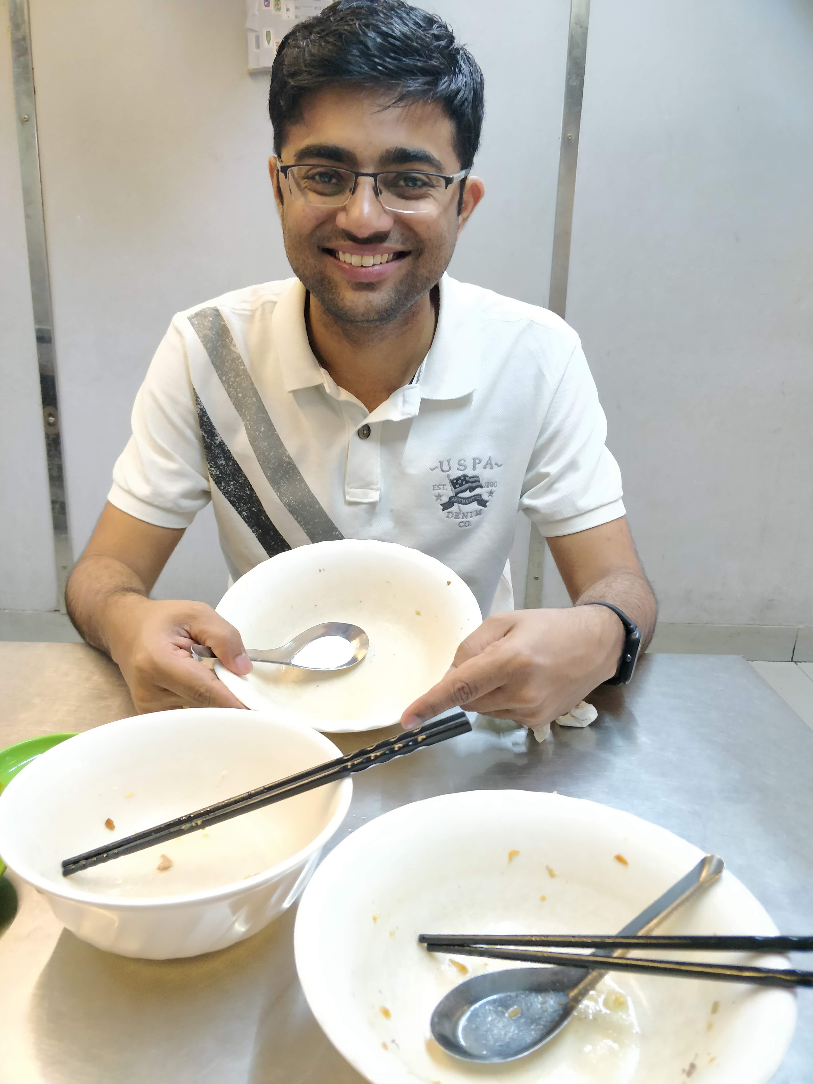 Happy with empty bowls of Vietnamese food in Hanoi