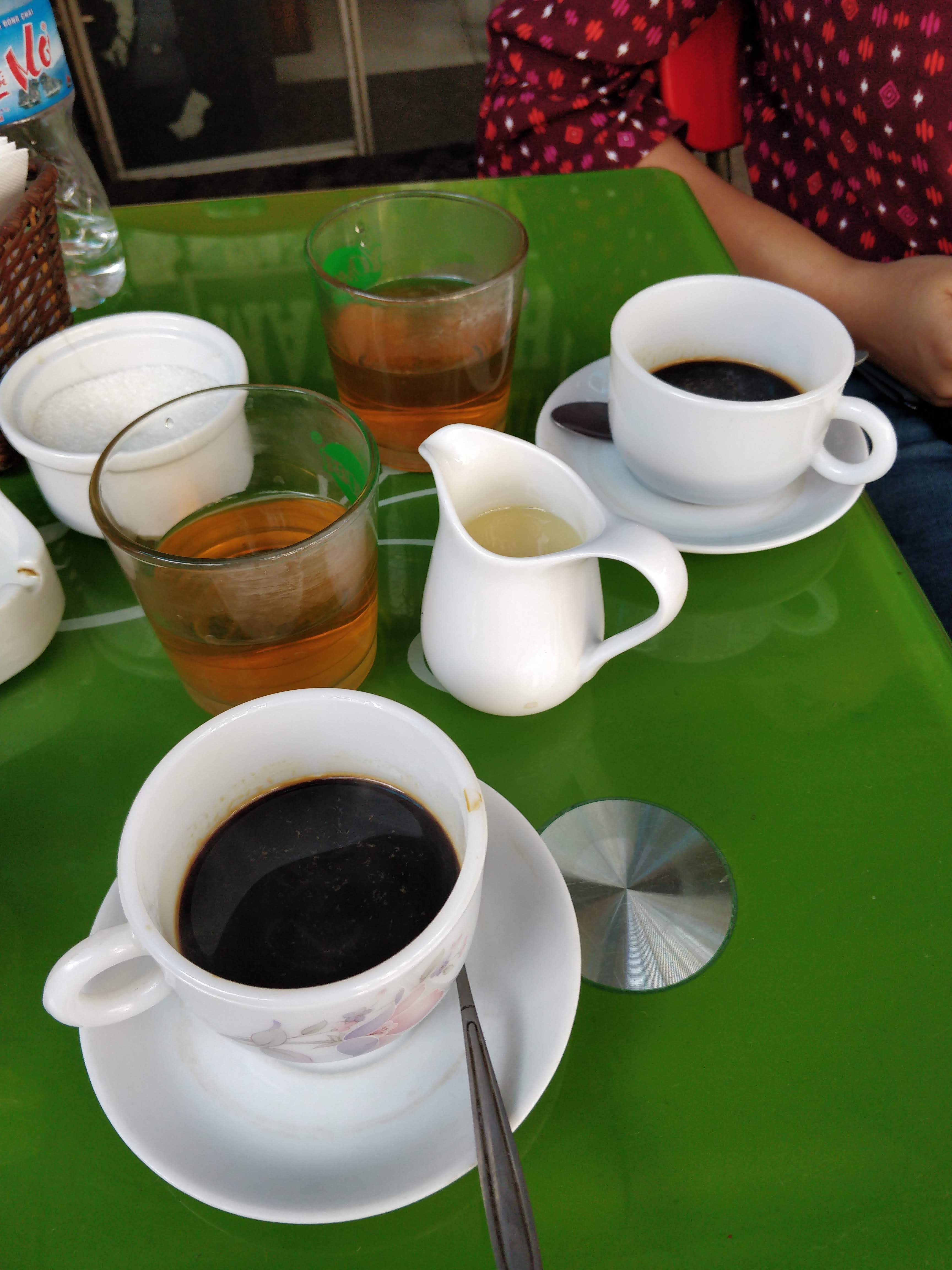 Vietnamese Coffee - black coffee + condensed milk with a cup of rice tea!