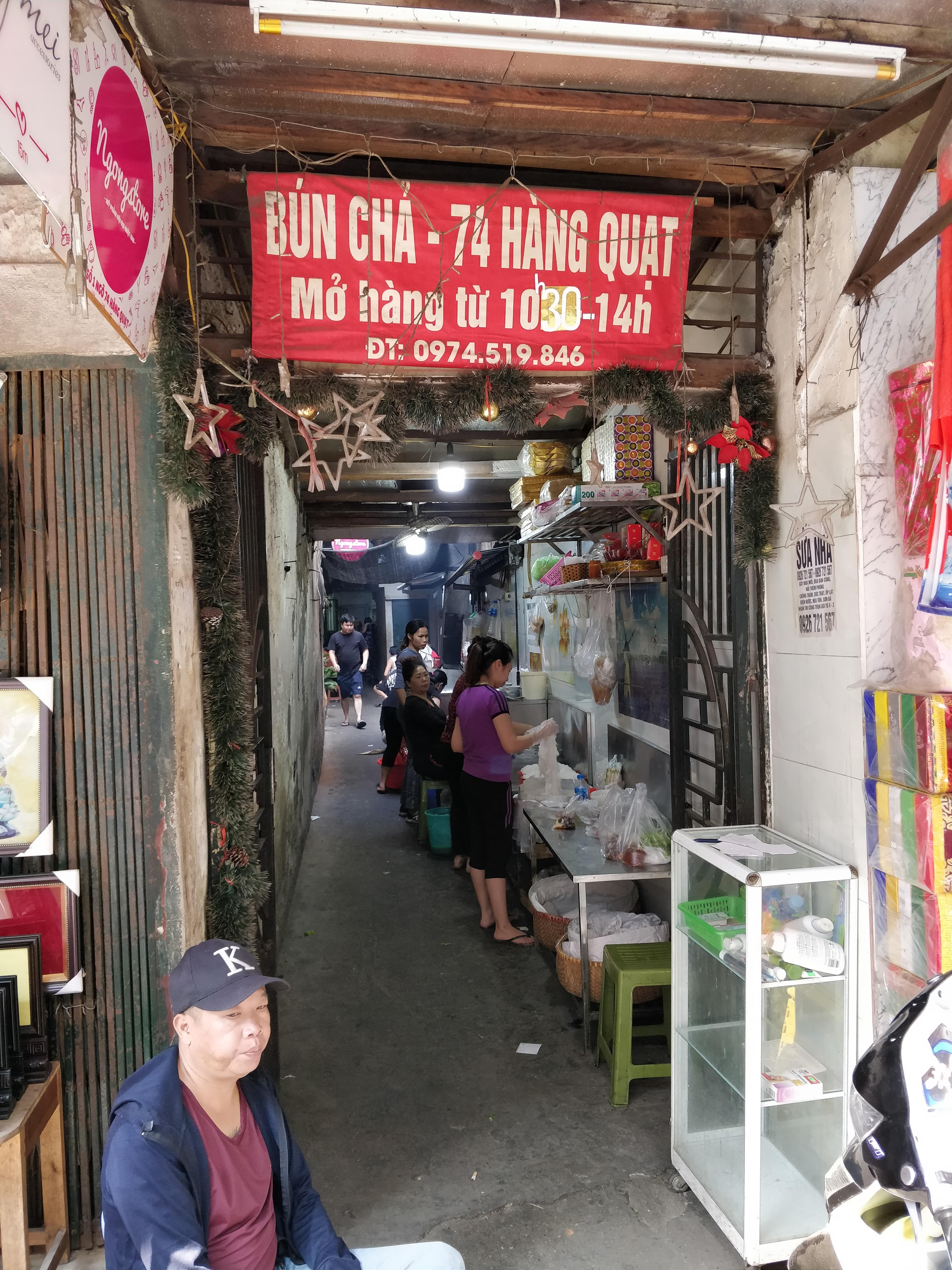 The alleyway to Bun Cha madness in Hanoi