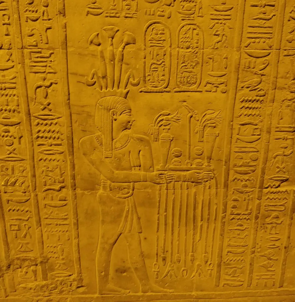 Hieroglyphs and inscription on Egyptian temple showing old calendar