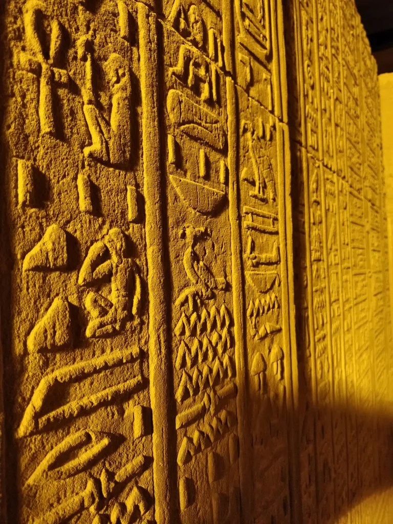 Hieroglyphs on the walls of the Egyptian temple at Kom Ombo dedicated to Sobek and Horus