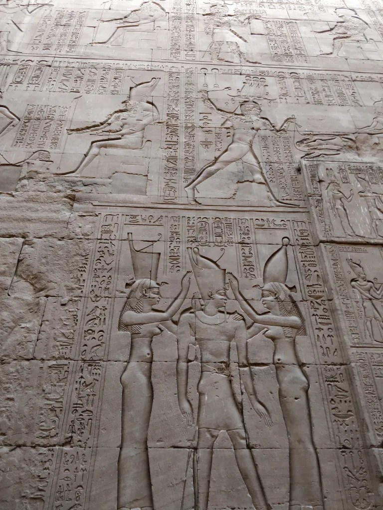 Detailed hieroglyphs depicting life of pharaohs and gods