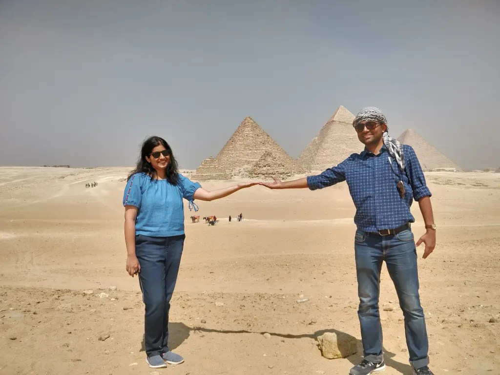 Posing in front of the pyramids