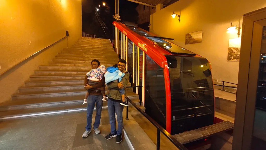 At the Tbilisi funicular with 2 sleeping kids