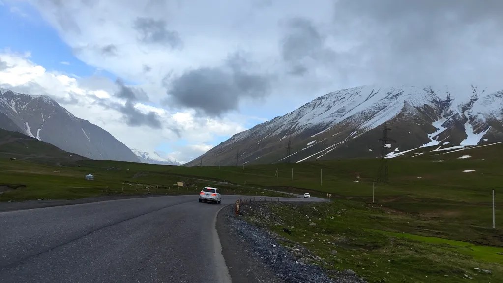 Driving through the snowy peaks of Gudauri - georgia itinerary