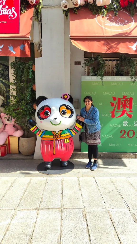 posing with pandas in Macau